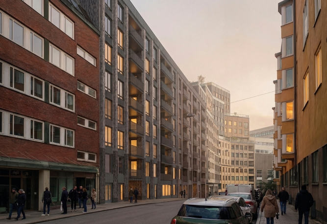 En stadsgata kantad av flerfamiljshus, med människor som promenerar och parkerade bilar längs vägen i skymningen.