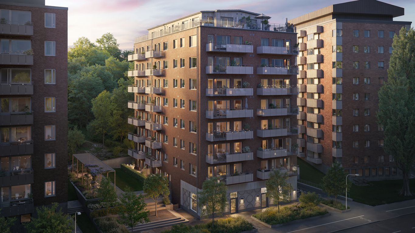 Ett flervåningshus i tegel med balkonger.