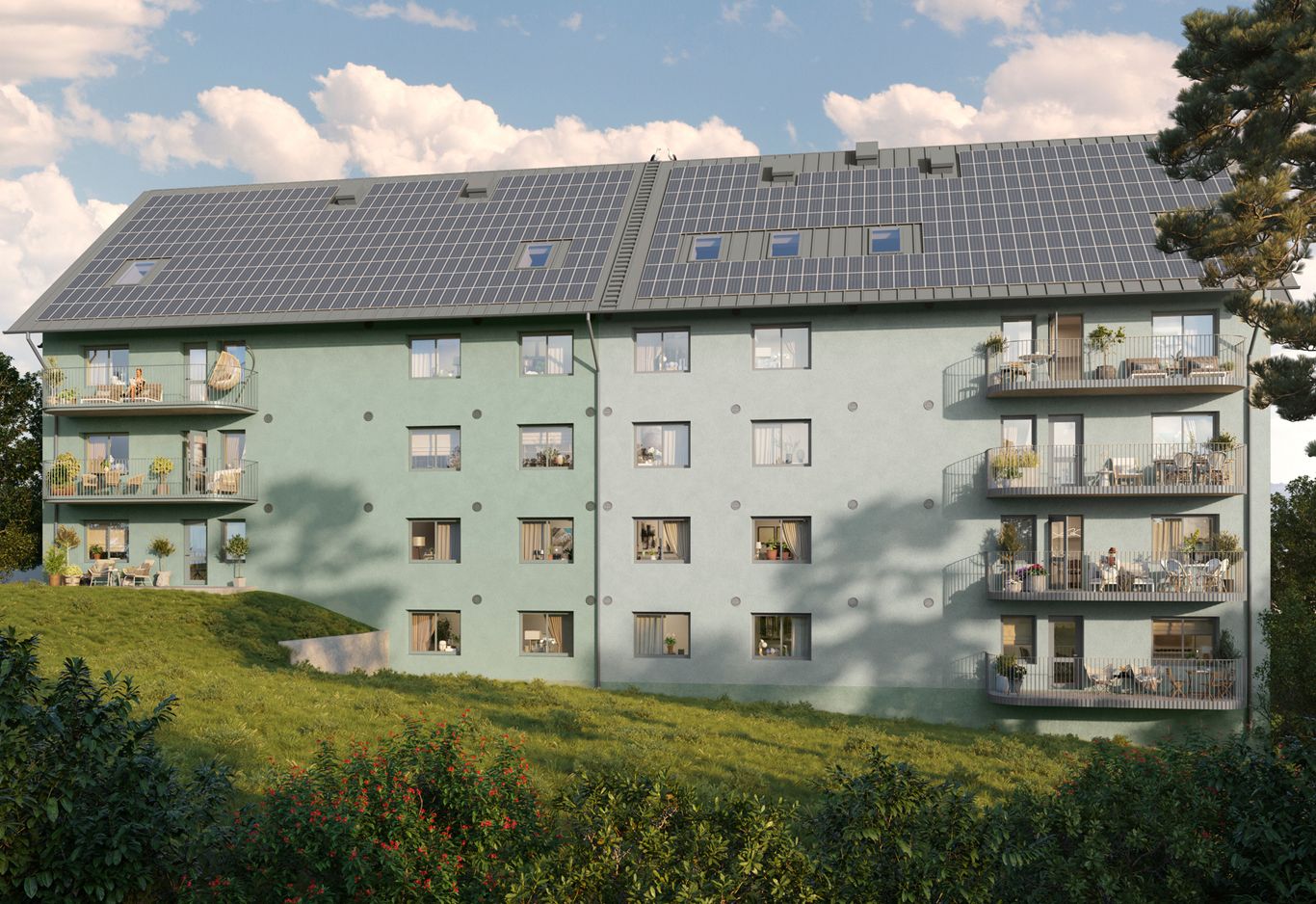 Husets gröna fasad ifrån långsidan