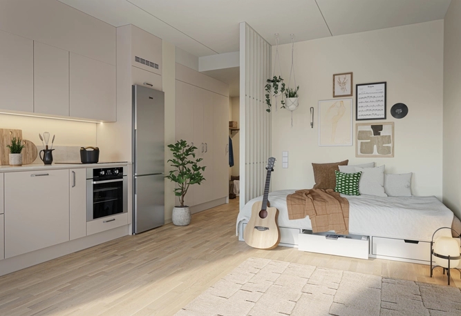 Lägenhet med sovalkov. Vid sängen står en guitarr.