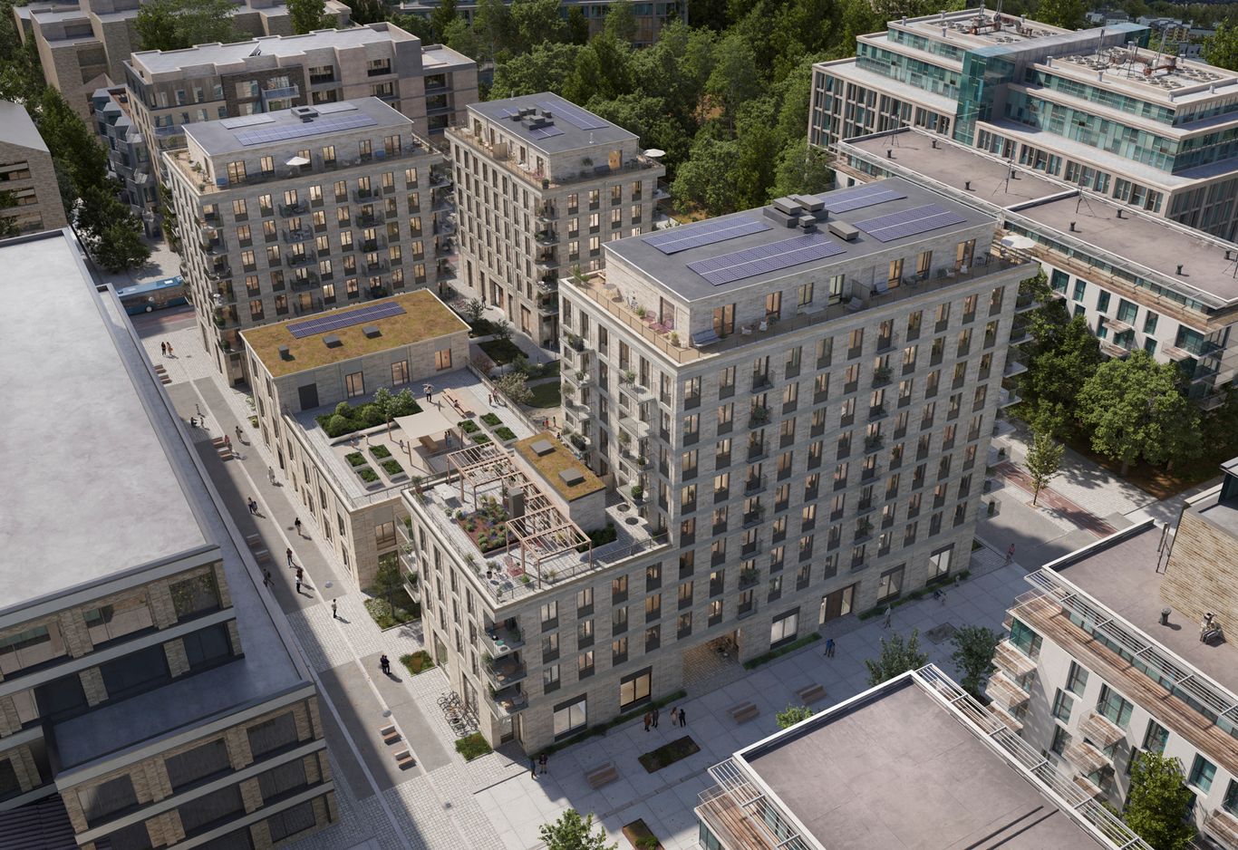 Fransyskan exteriör över hela kvarteret med tegelfasad, takterrasser och balkonger. Gemensam takterrass med pergola.