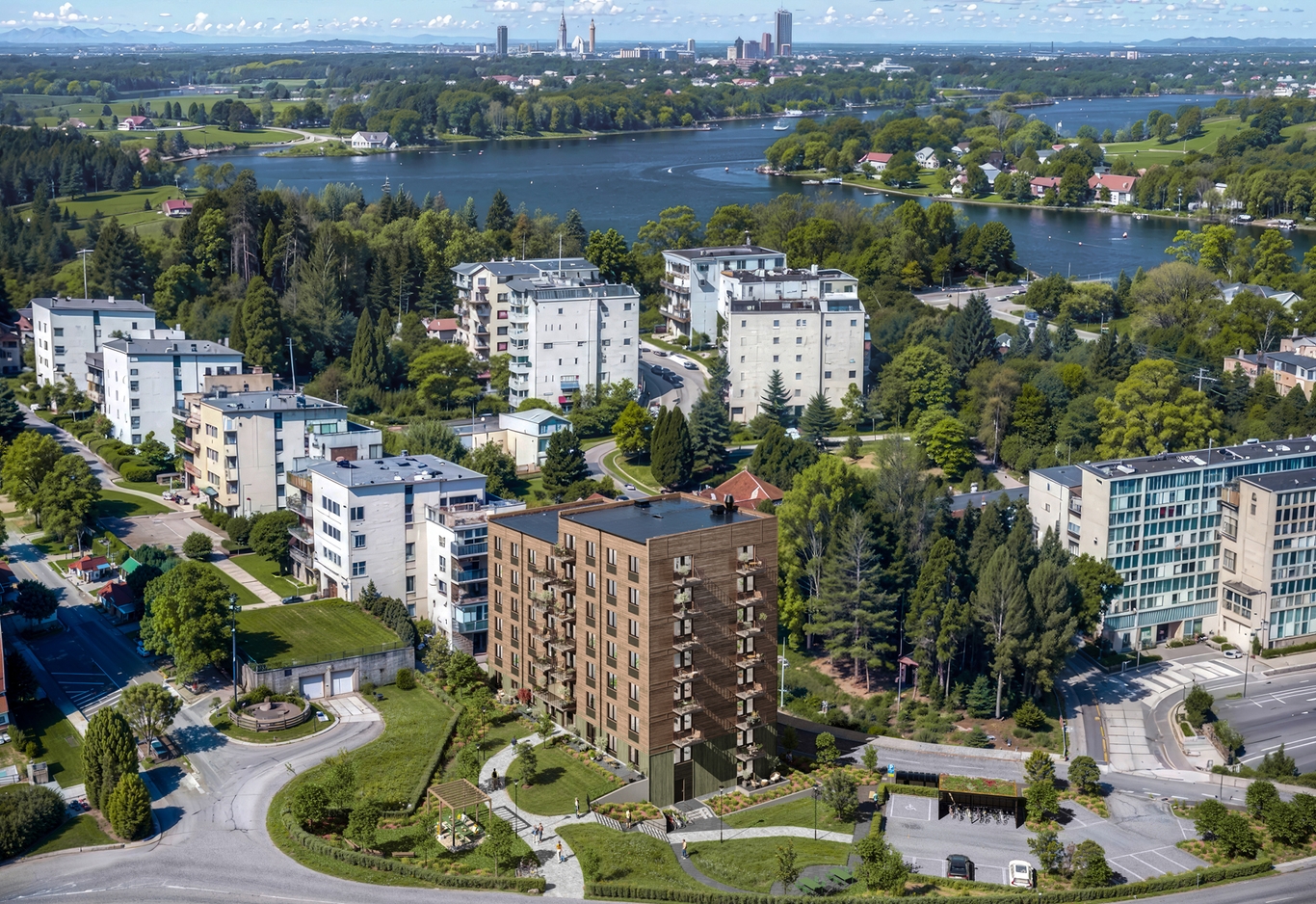 Flygbild över Danderyd med Herthas bostadsbyggnad renderad i verkligt bostadskvarter omgivet av grönska och andra byggnader.